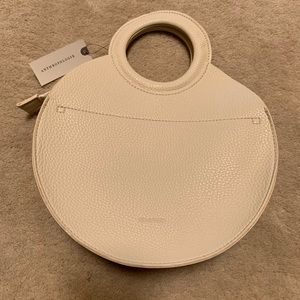 cream and gold Anthropologie bag